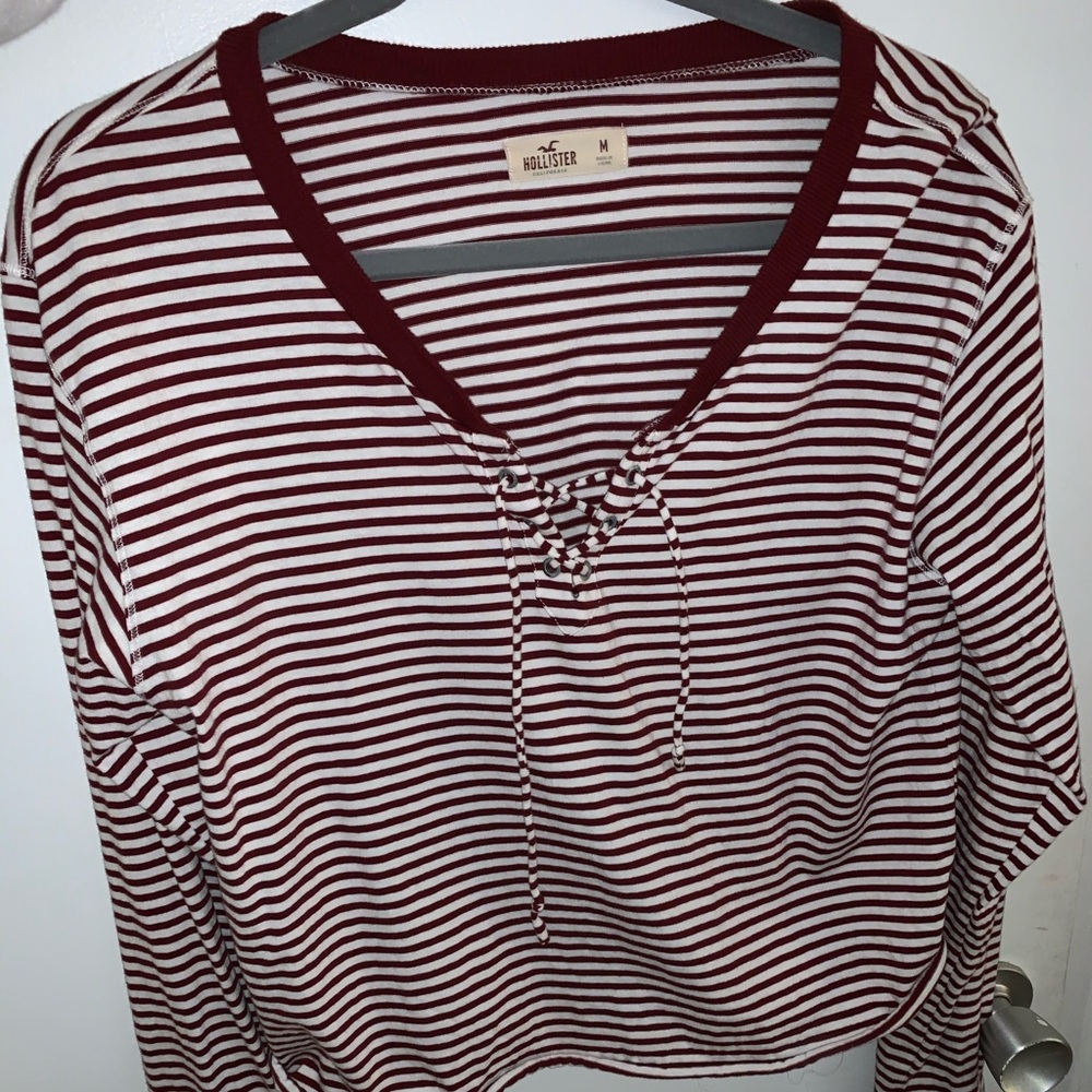Maroon and white striped shirt.
